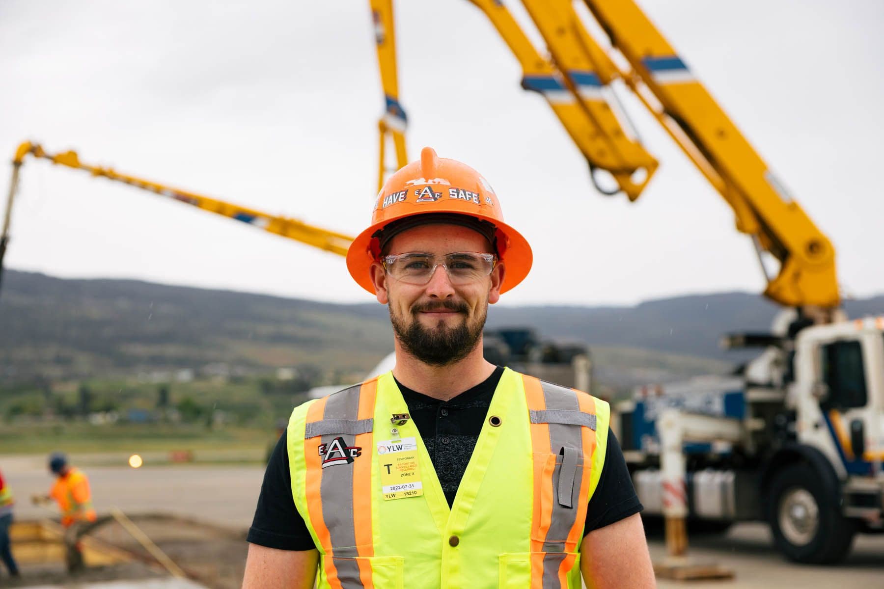 Male EAC employee posting on site at the Kelowna Airport