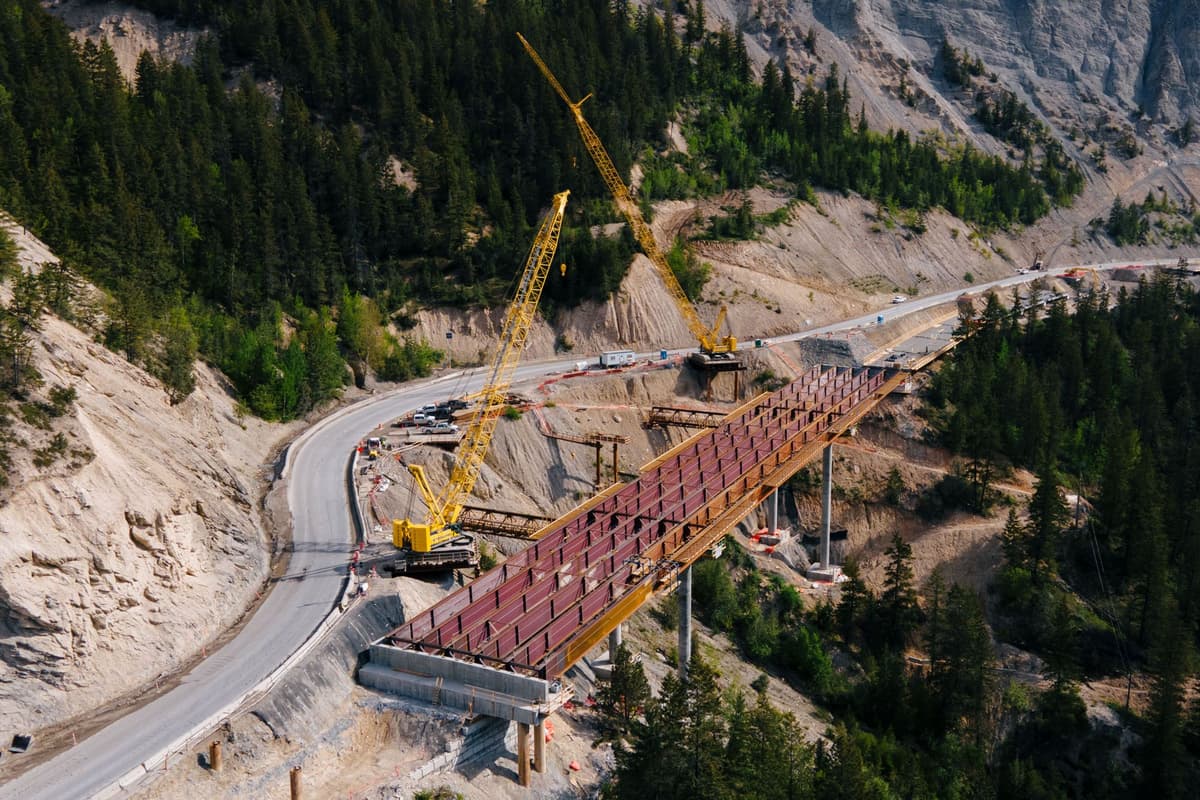 Large bridge span being installed on Kicking Horse Canyon Project, Phase 4